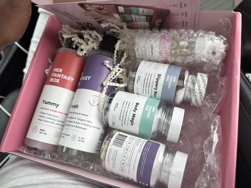 Customer's Balance Bundle box showing the collection of shower gels, supplement bottles, and oils neatly arranged.