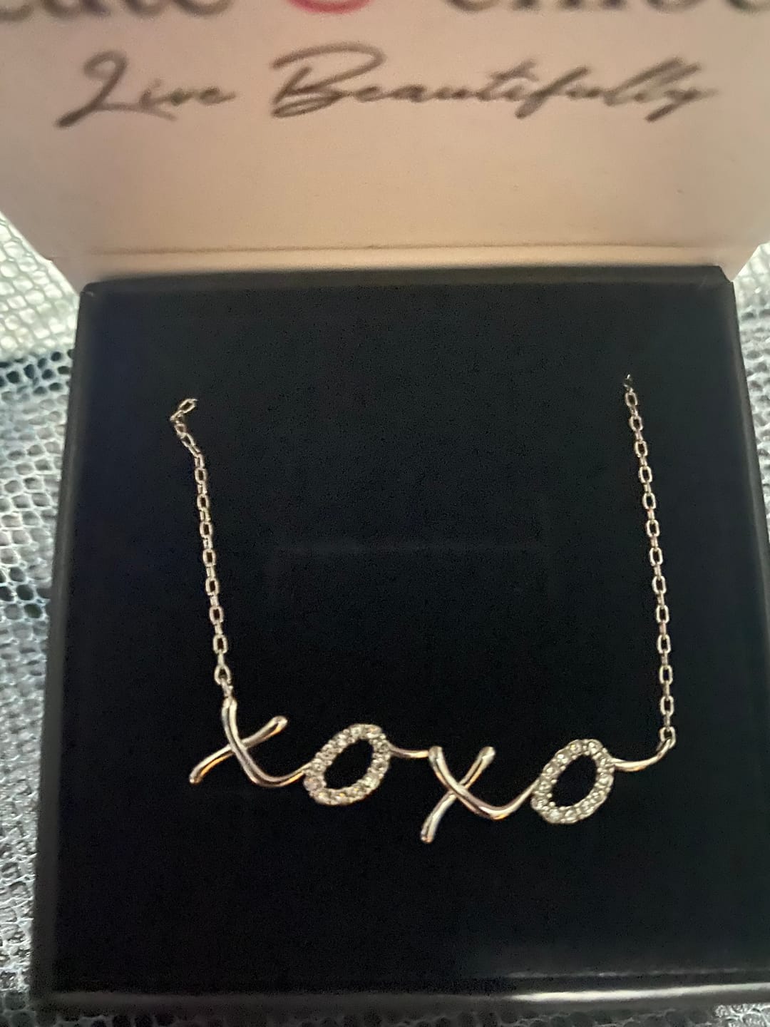 Customer photo review of Jocelyn 18k White Gold Plated XOXO Pendant Necklace with Swarovski Crystals