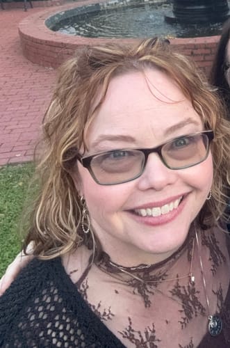 Customer's smiling selfie showing skin after using The Micro Infusion System.