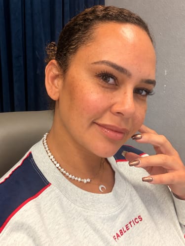 Customer's Rhoni gold paper clip and pearl necklace worn layered around the neck.