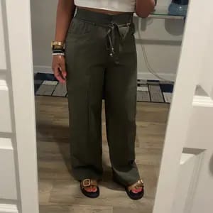 Customer photo review of Lace-up Trousers Loose-fit Drawstring Wide-leg Pants With Multiple Pockets