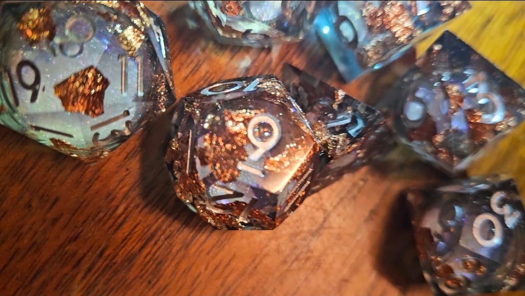 Customer photo review of URWizards D&D Starry Liquid Heart Resin Engraved Dice Set Copper Flakes