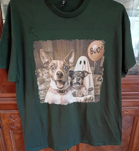 Customer's green Custom Dog Cat Photo Halloween shirt featuring a printed photo of two dogs and a ghost holding a BOO sign.