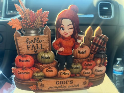 Customer's personalized Hello Fall wooden plaque featuring a cartoon figure and pumpkins labeled with grandchildren's names.