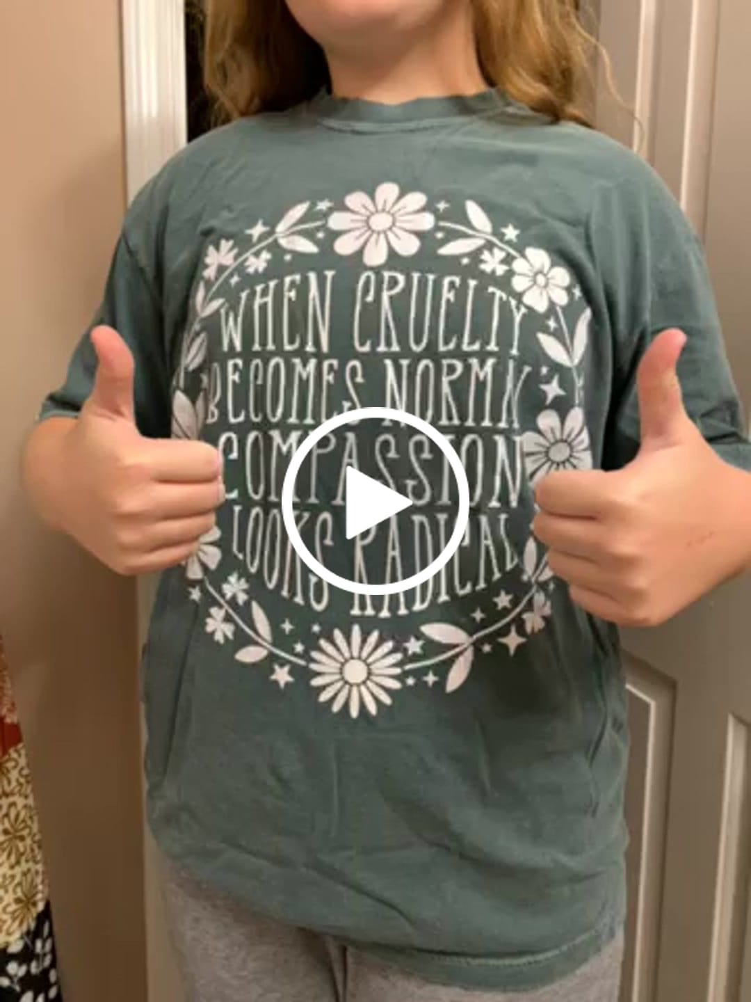 Customer video review of When Cruelty Becomes Normal Compassion Looks Radical Tee