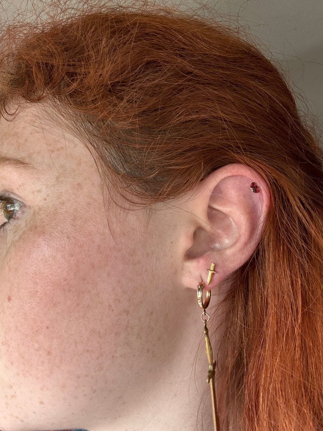 Customer photo review of The 14kt Gold Tri Marquise Garnet Stud Top