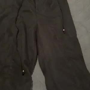 Customer photo review of Lace-up Trousers Loose-fit Drawstring Wide-leg Pants With Multiple Pockets