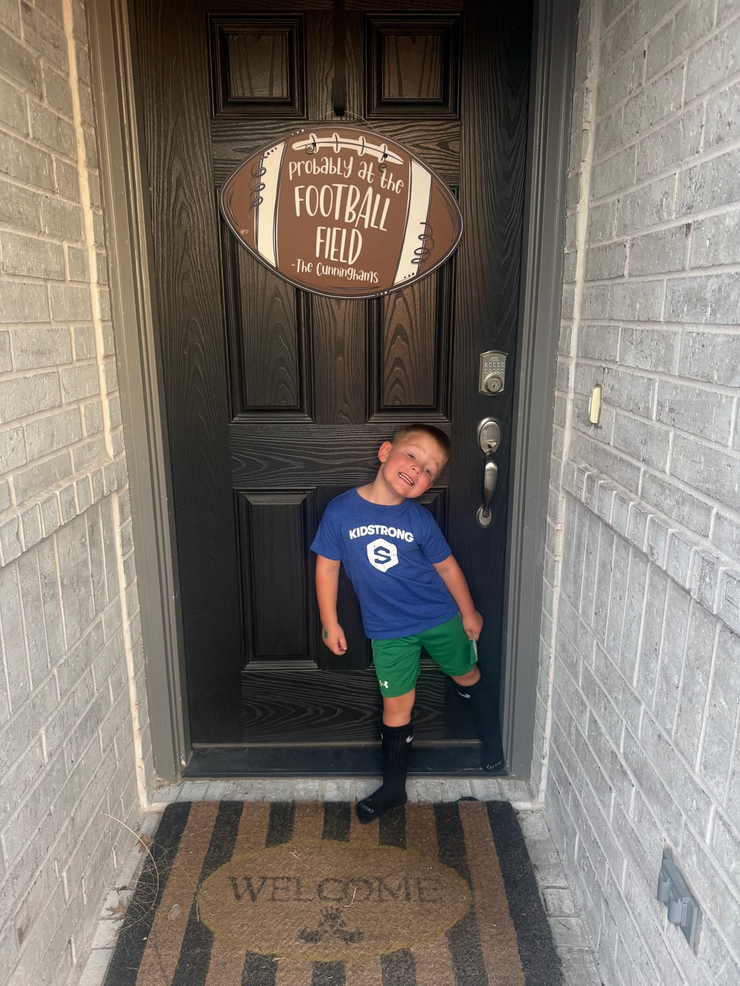Customer photo review of Probably at the Football Field Custom Door Hanger