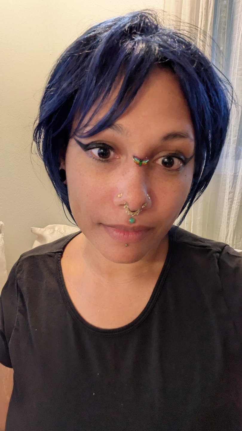 Customer photo review of Rainbow Death's Head Moth Septum + Daith Ring