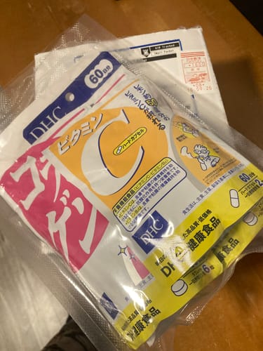 Customer's DHC Vitamin C supplement package and shipping parcel