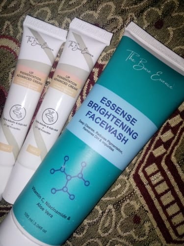 Customer's pack of two Lip Pigmentation Advanced Cream tubes and one Essense Brightening Facewash tube on a patterned rug.