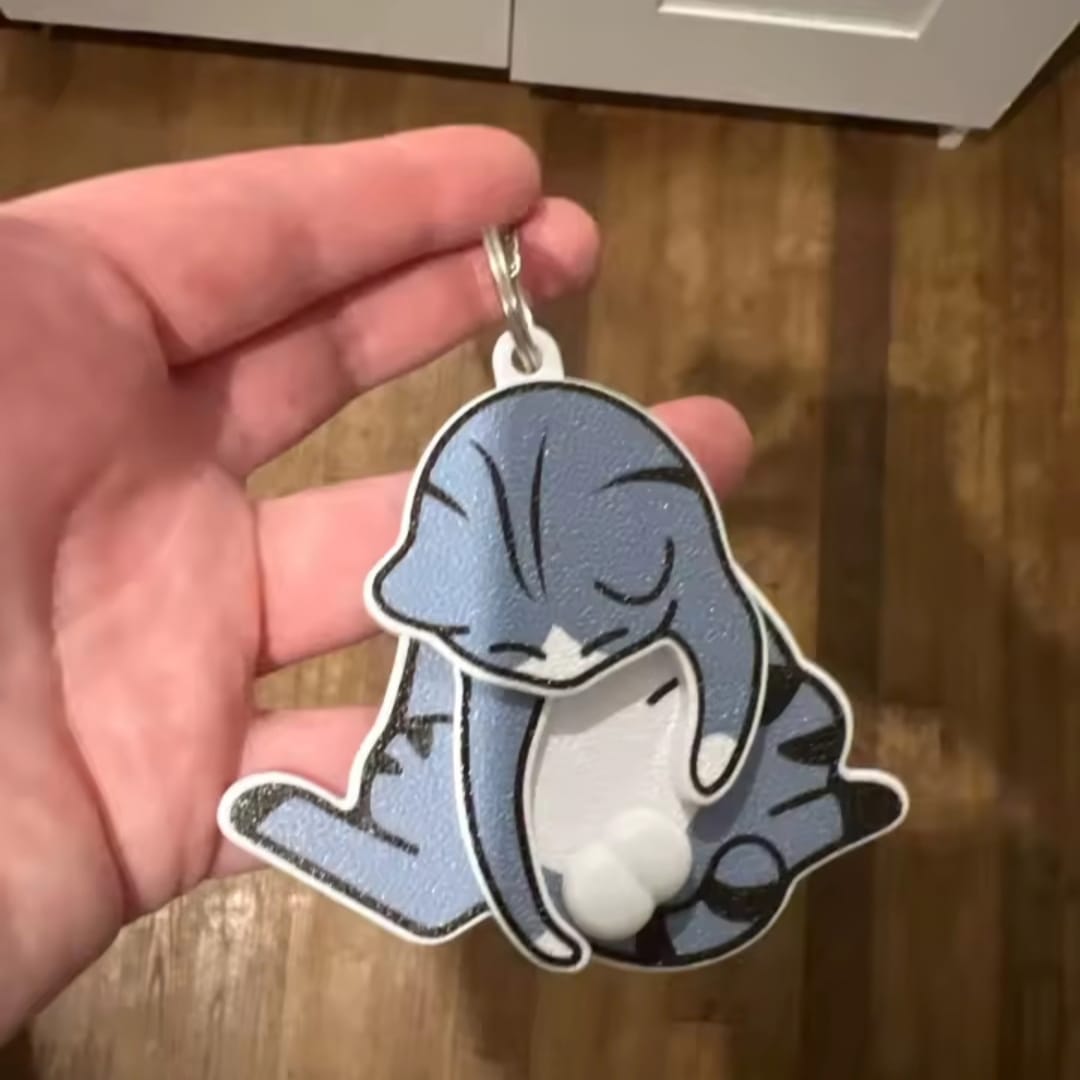 Customer photo review of Mischief Cat - Interactuve Cat Keychain