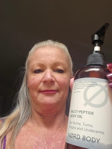 Customer photo review of NØRD BODY Peptide Body Oil