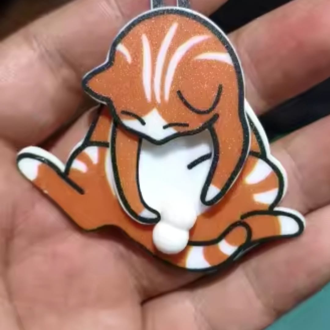 Customer photo review of Mischief Cat - Interactuve Cat Keychain