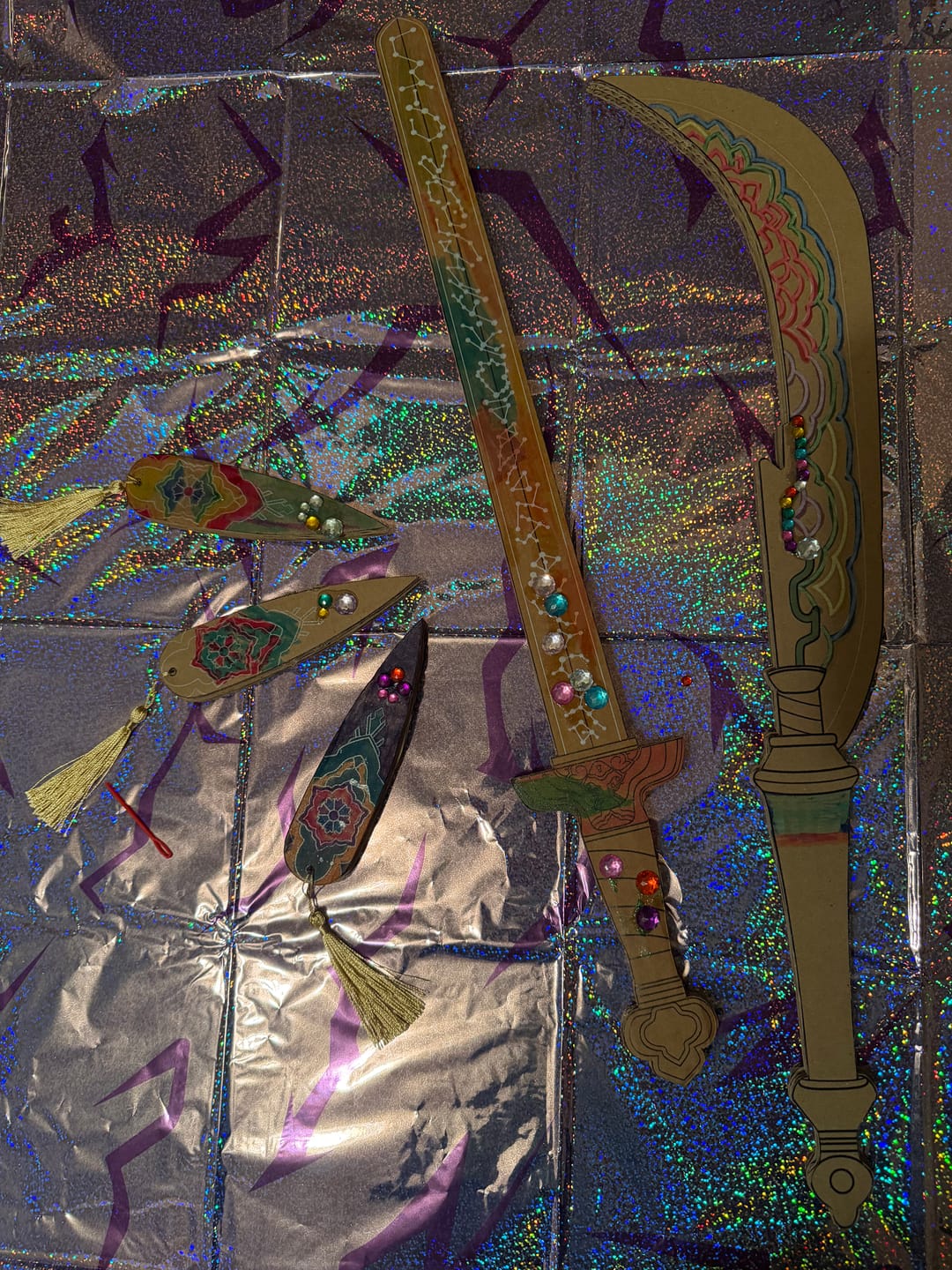 Customer photo review of DIY KPop Demon Hunter Cardboard Swords, Axes, and Daggers for Kids – Birthday Party Craft, Recyclable Sword Decoration Activity