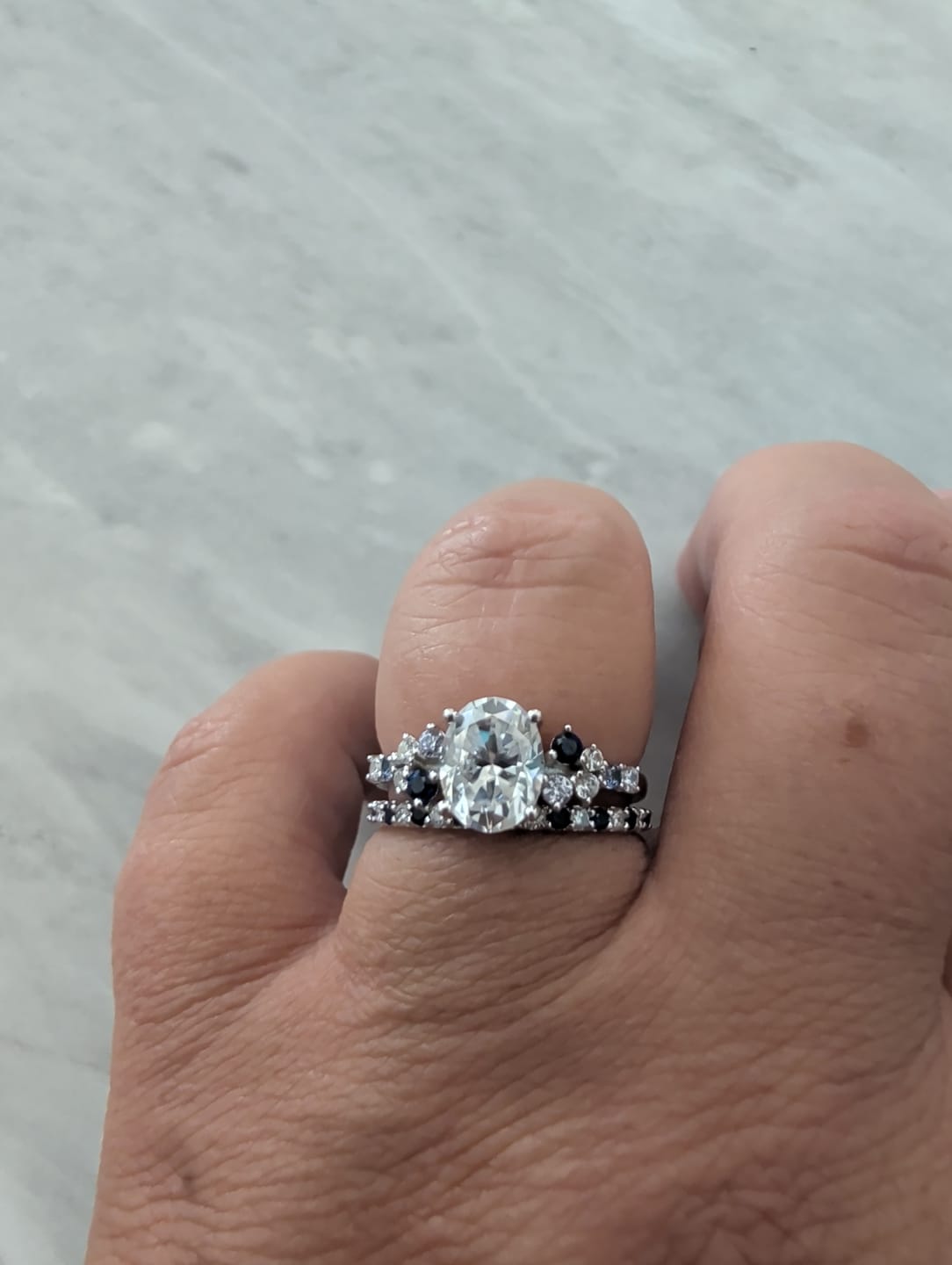 Customer photo review of Alternating Moissanite And Sapphire Eternity Wedding Band Ring