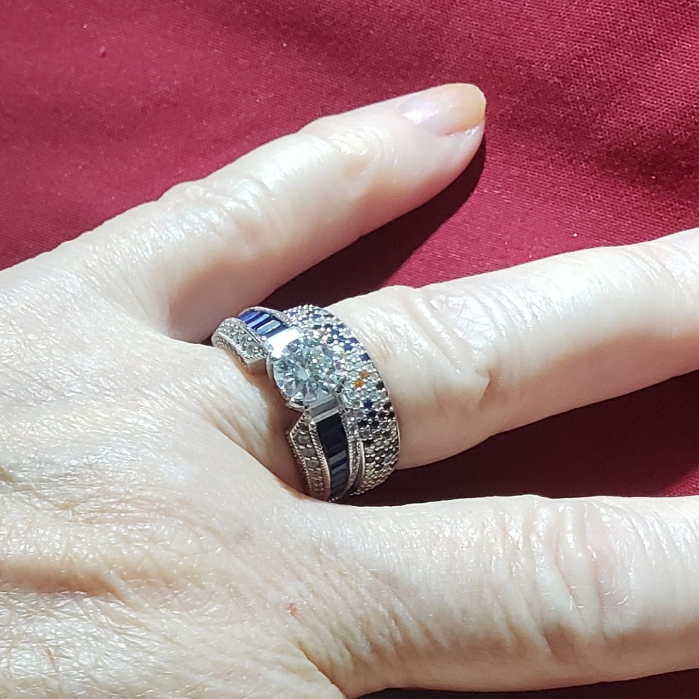 Customer photo review of Round Moissanite And Emerald-Cut Sapphire Channel Set Milgrain Engagement Ring