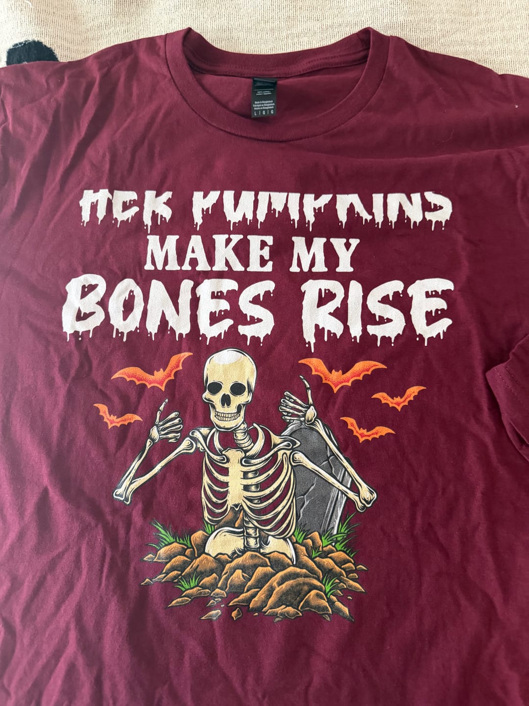 Customer photo review of Her Pumpkins Make My Bones Rise | Deluxe Unisex Tee v2