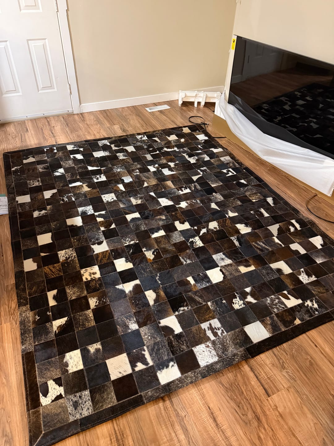 Customer photo review of SUPER SALE Brown & White Patchwork Brindle Natural Cowhide Area Rug - 6' 7" x 8' 3"