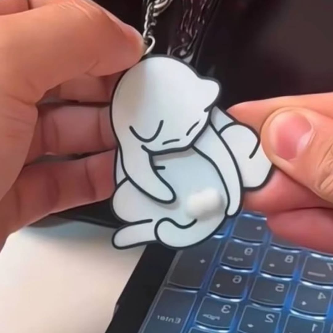 Customer photo review of Mischief Cat - Interactuve Cat Keychain