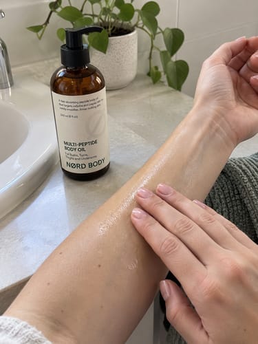 Customer photo review of NØRD BODY Peptide Body Oil