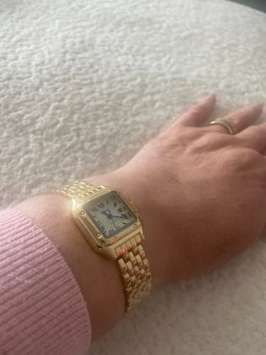 Customer's gold Grealy De Mains watch worn on their wrist
