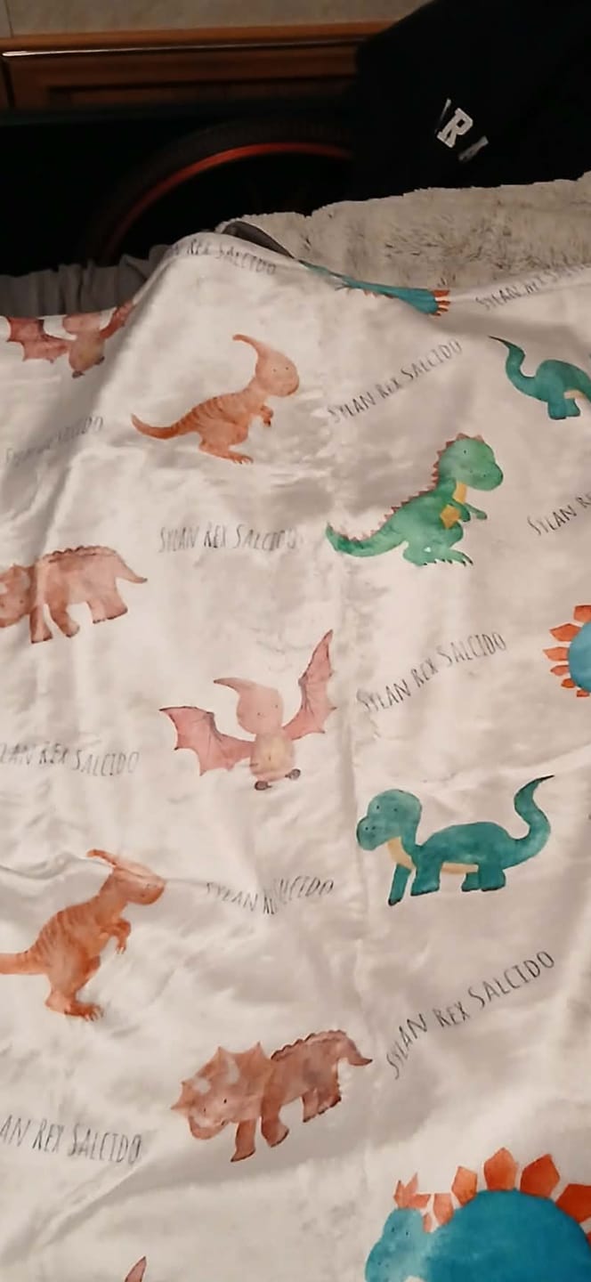 Customer photo review of Personalized Dinosaur Watercolor Print Baby Name Blanket
