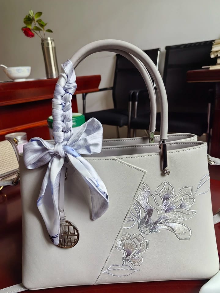 Customer photo review of Tang Red 30 Embroidered Magnolia Tote