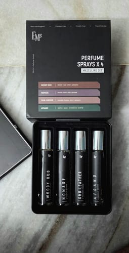 Customer's Masculine Perfume Collection EDP set in an open black box with four individual fragrance vials.