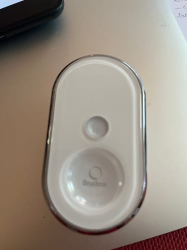 Customer's white, oval-shaped Onychom Pro nail device, top view.