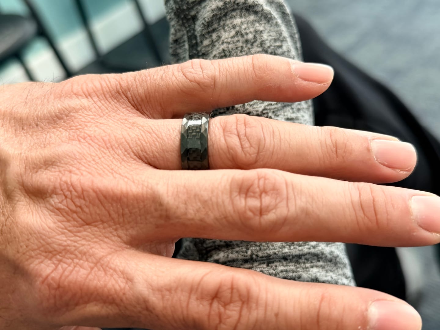 Customer photo review of SPEEDSTER | Black Tungsten Carbon Fiber Center Faceted Sides Wedding Ring 8mm