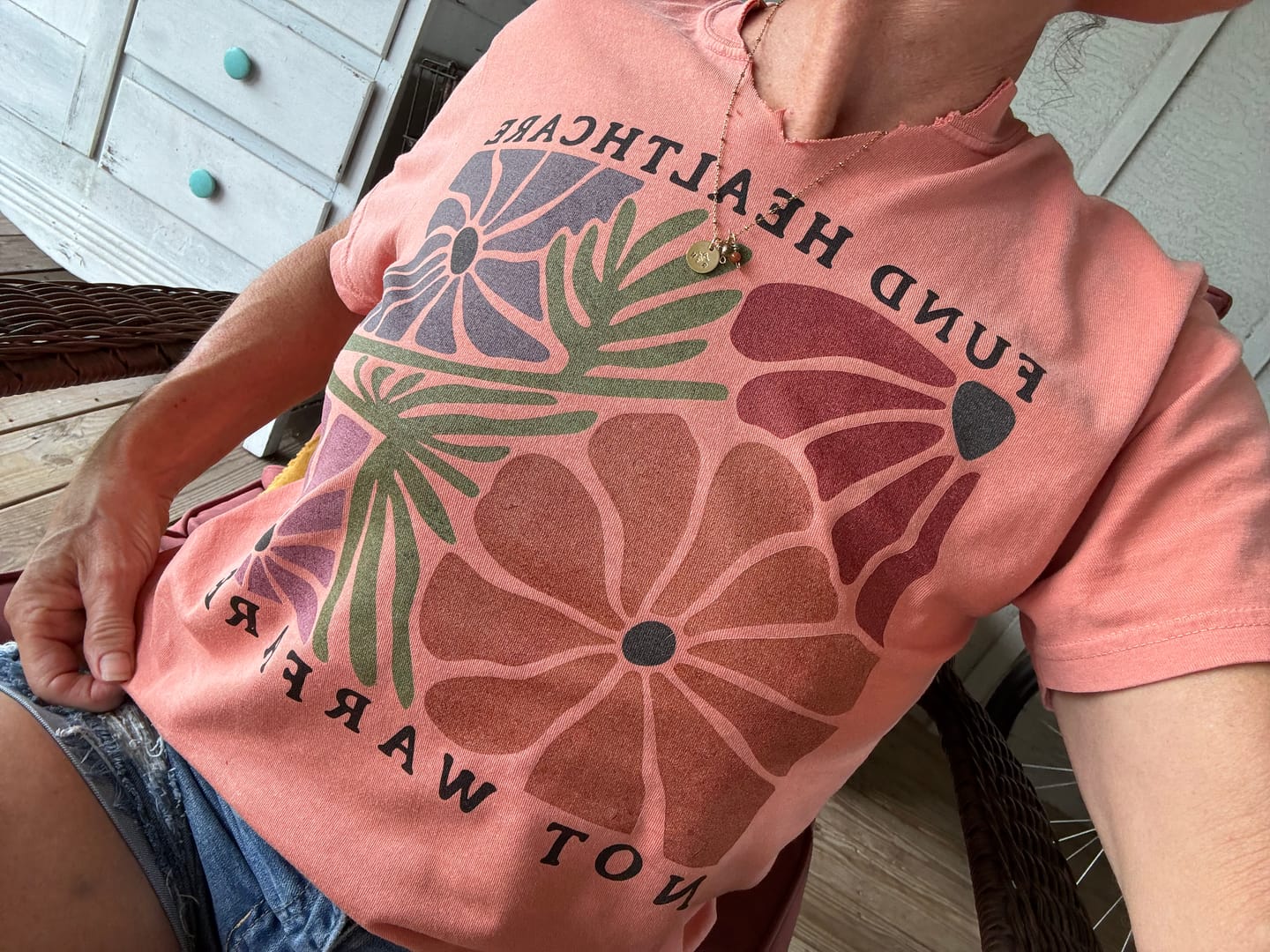 Customer photo review of Fund Healthcare Not Warfare Tee