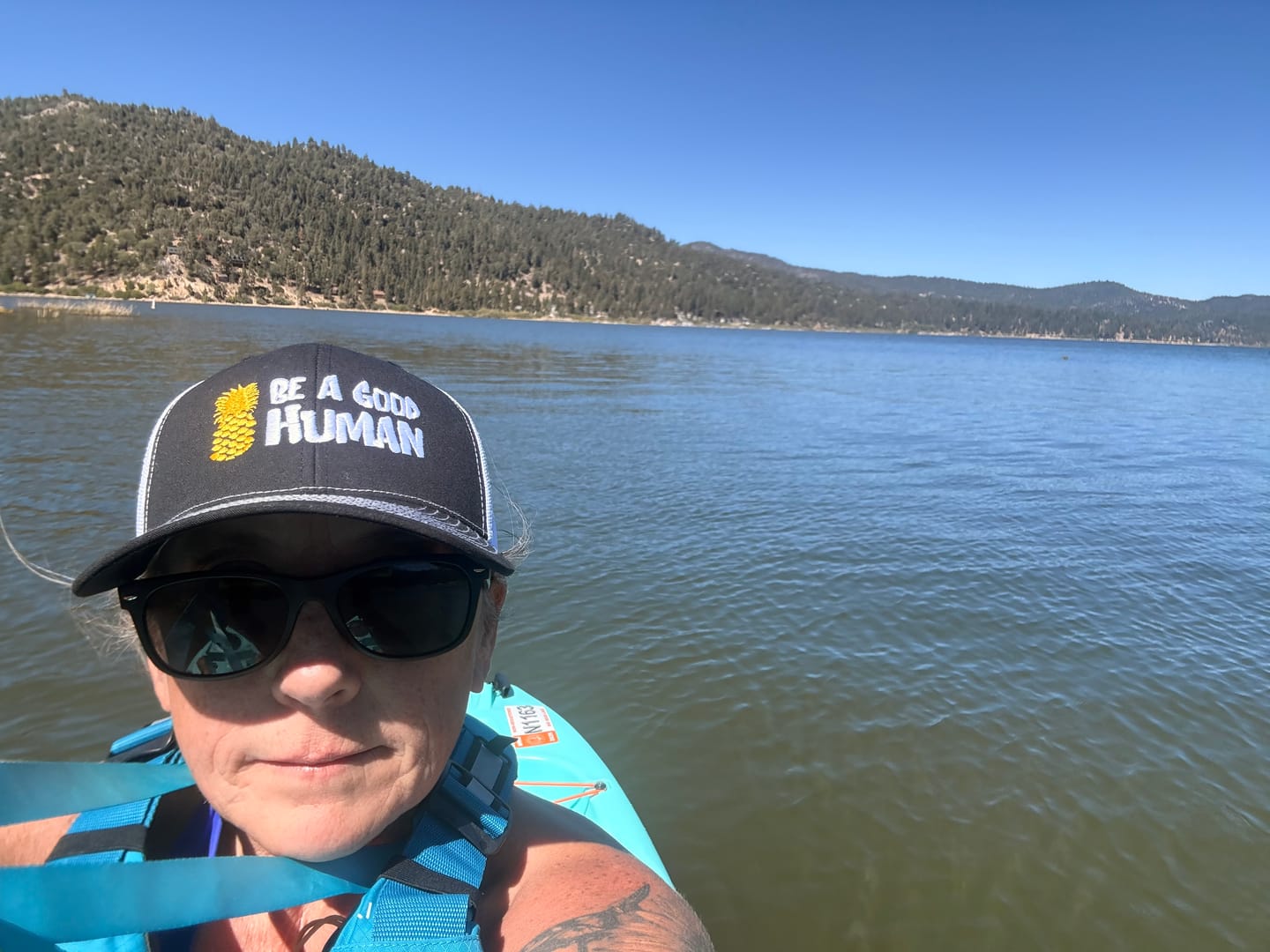 Customer photo review of Be A Good Human Cartoon Embroidered Trucker Hat