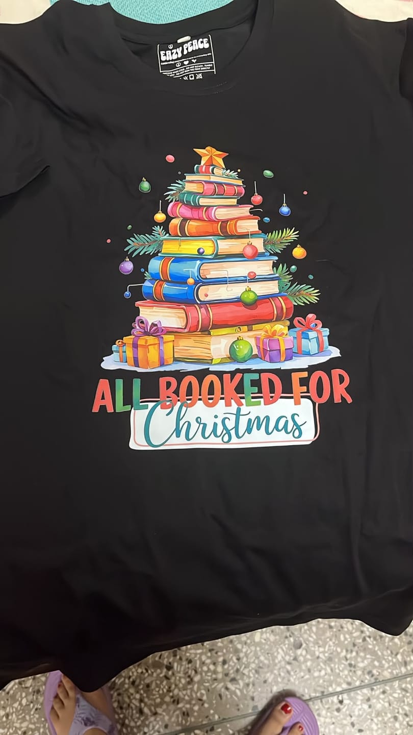 Customer photo review of All Booked Christmas T-Shirt | Bookworm Holiday Reading Tee