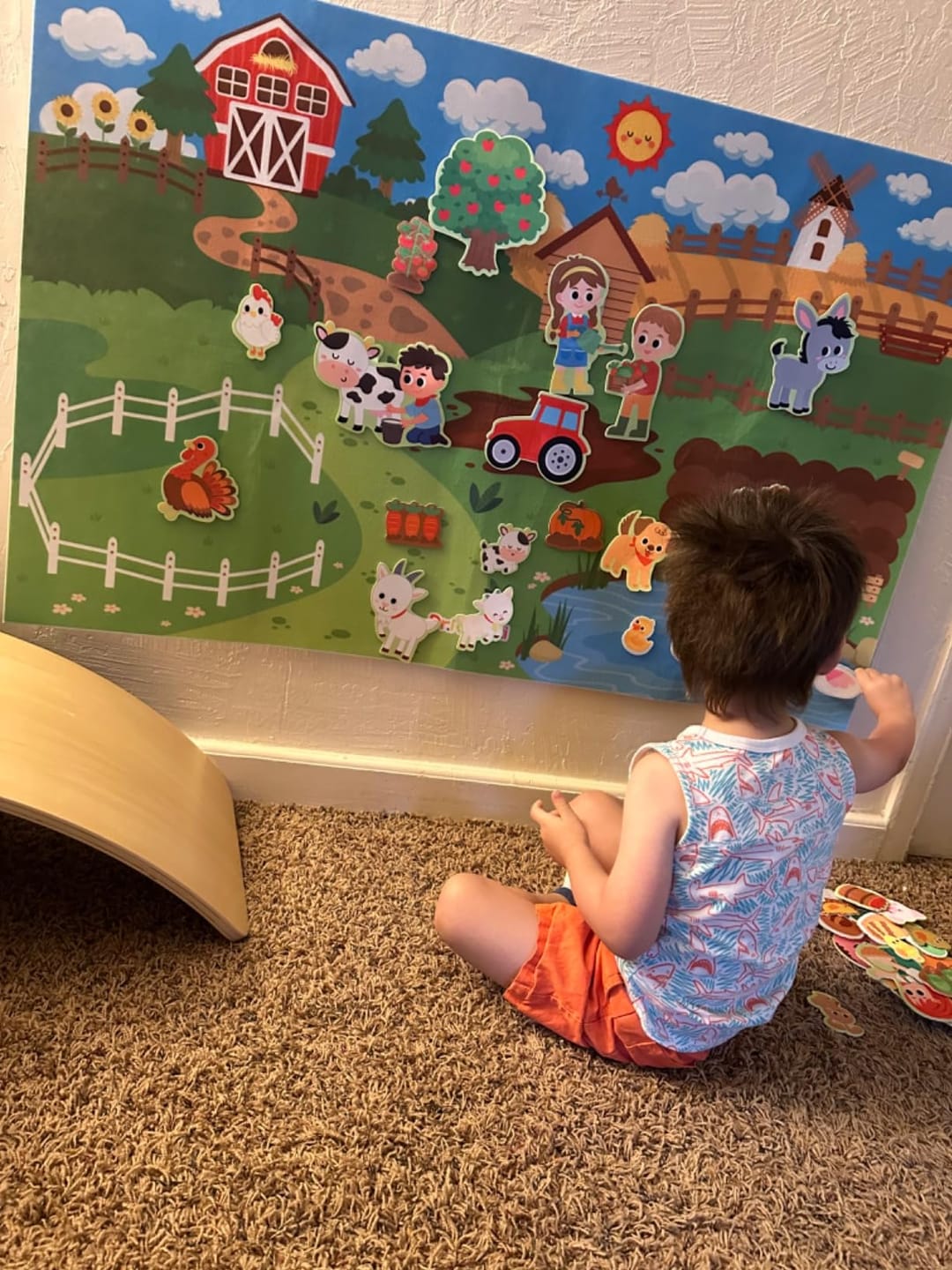 Customer photo review of Littlestorieskids Interactive Activity Board: Inspiring independent play from the very first use.