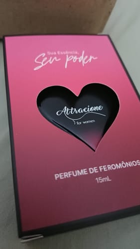 Customer's Attracione Sensual perfume box in pink and dark red with a heart-shaped cutout.