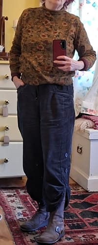 Customer's vintage floral half-turtleneck sweater worn with dark trousers