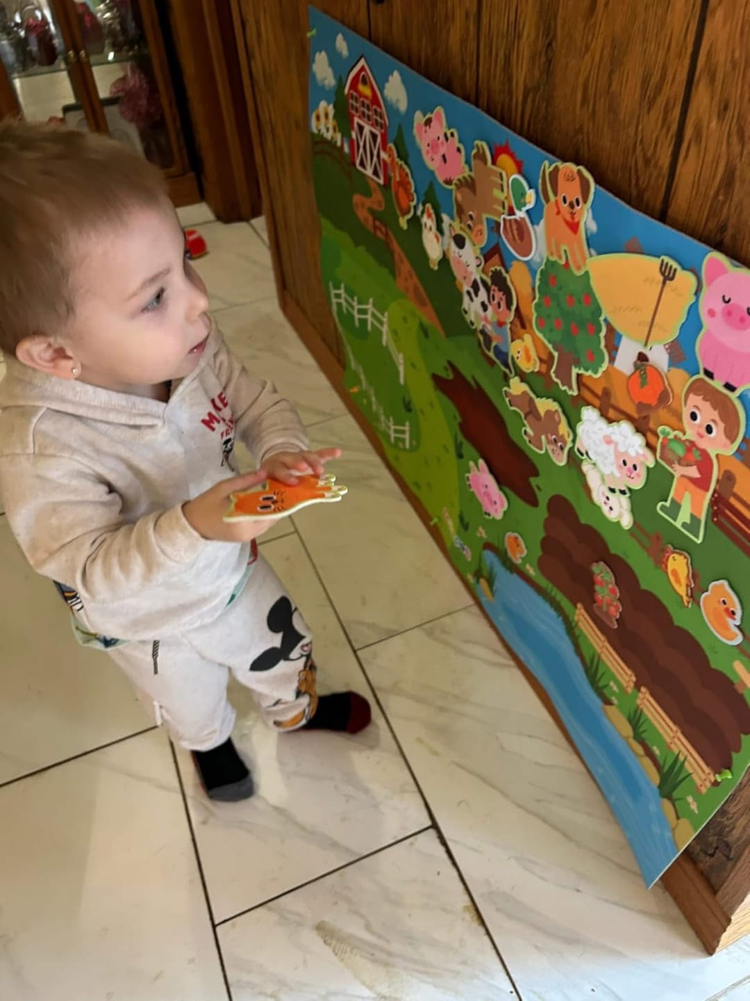 Customer photo review of Littlestorieskids Interactive Activity Board: Inspiring independent play from the very first use.