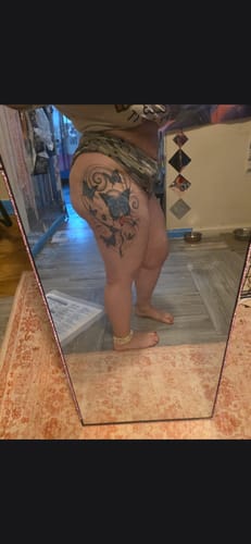 Customer's thigh showing a fresh butterfly tattoo after using the Eternal Tattoo Care Bundle.
