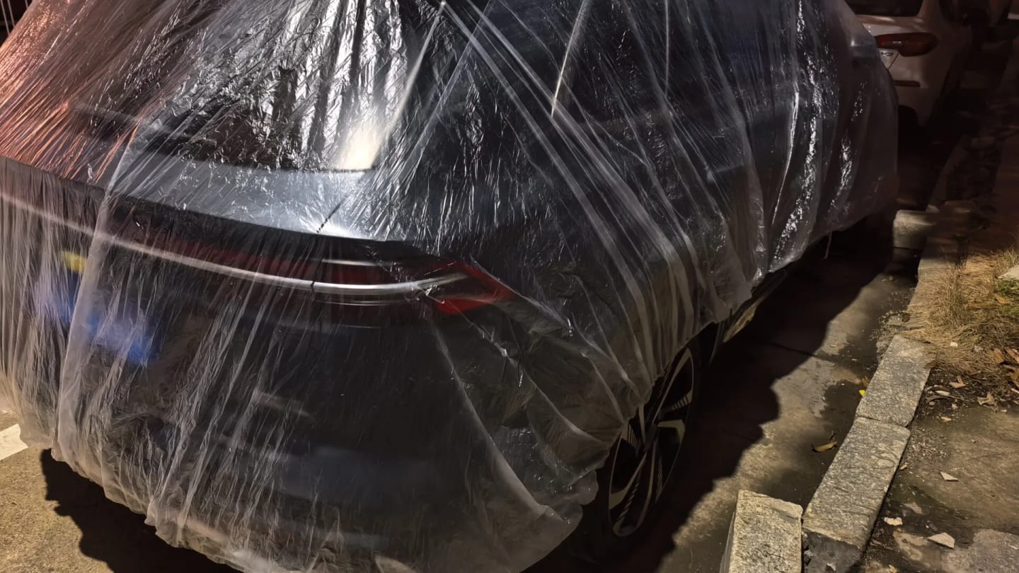 Customer photo review of All-Weather Disposable PE Car Cover – Indoor/Outdoor Dust & Rain Protection