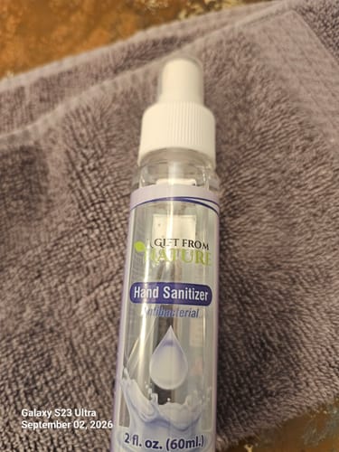 Customer's A Gift From Nature antibacterial hand sanitizer spray bottle resting on a soft grey towel.