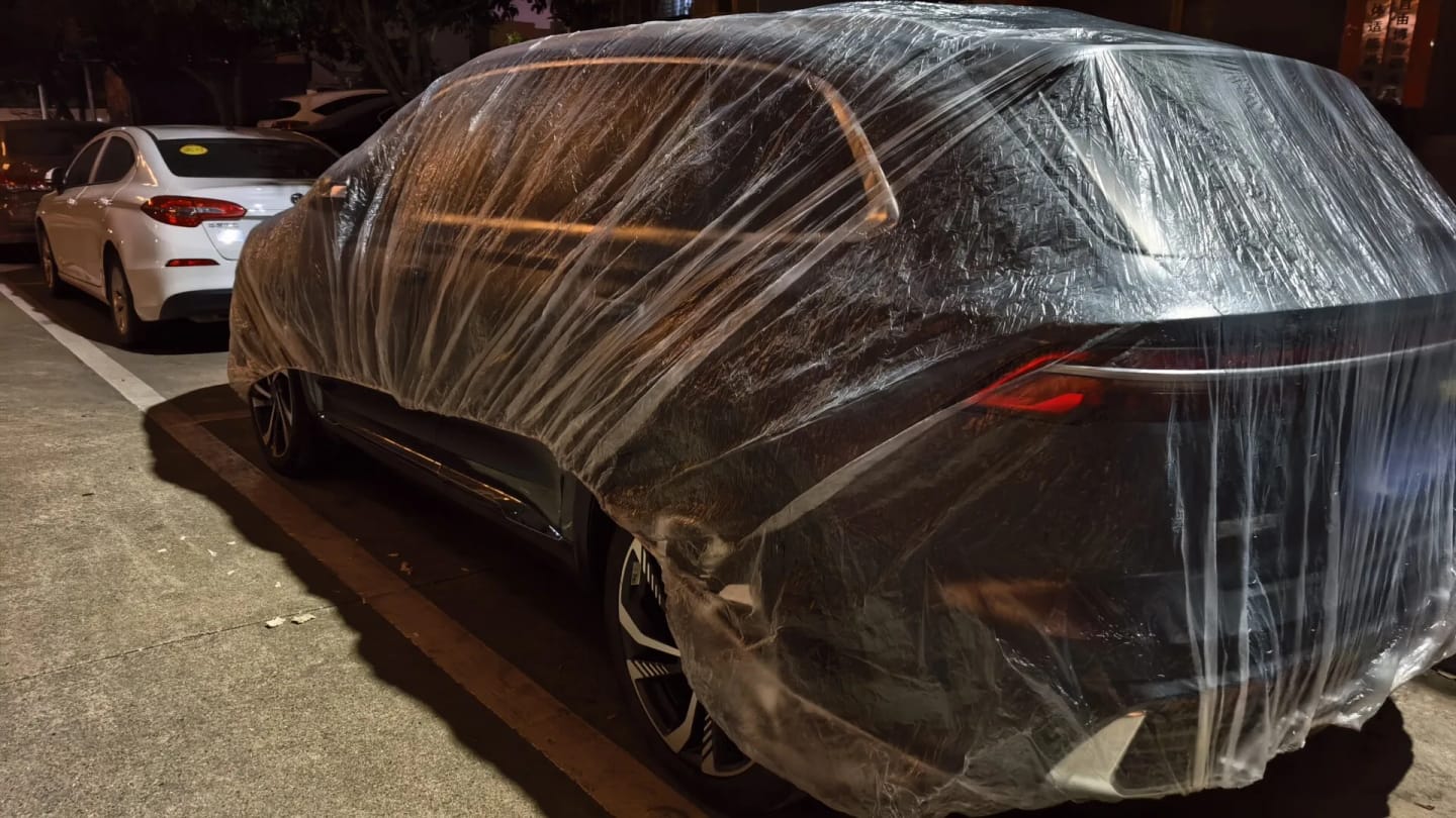 Customer photo review of All-Weather Disposable PE Car Cover – Indoor/Outdoor Dust & Rain Protection