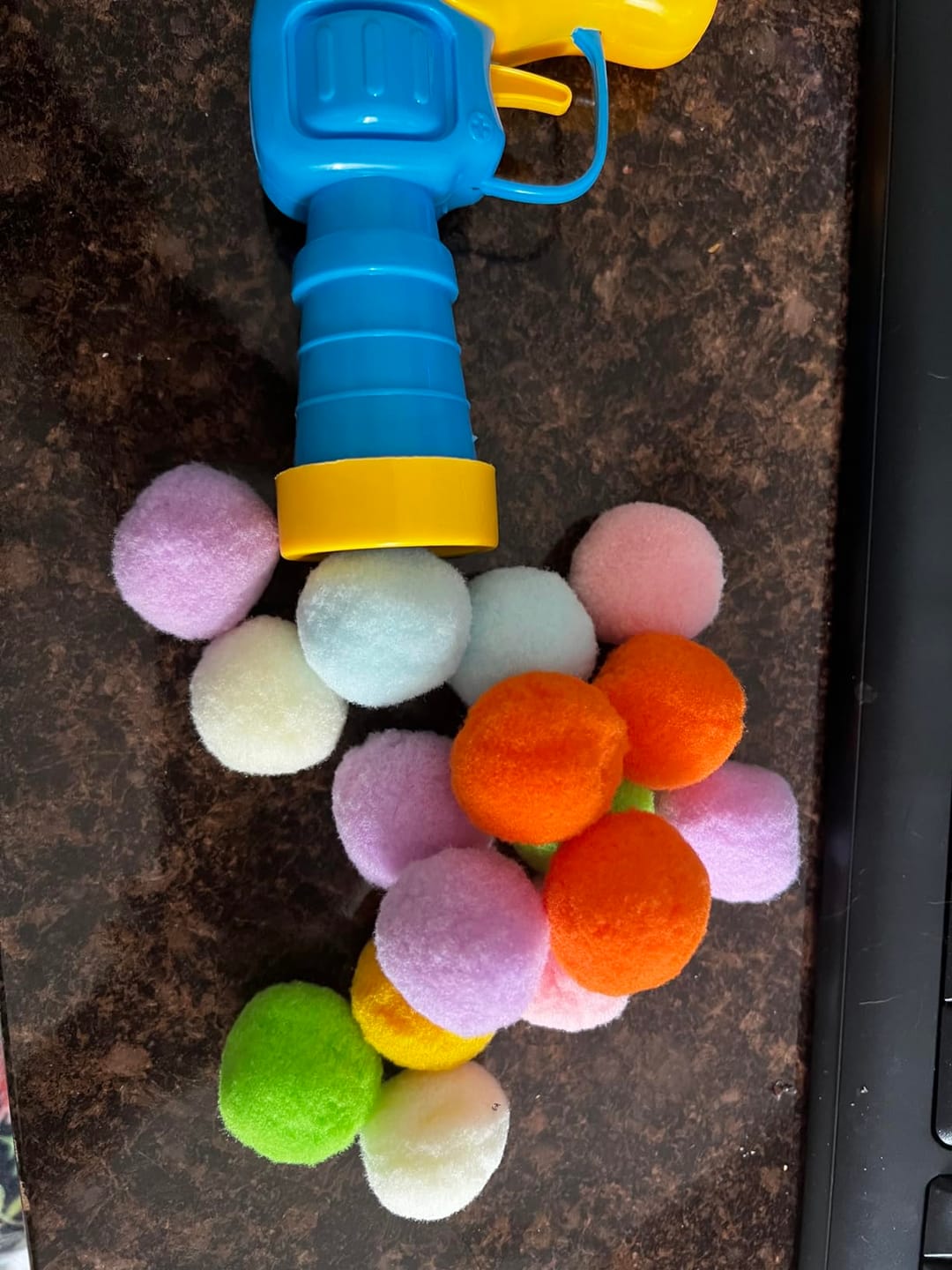 Customer photo review of Calming Puff Launcher (100 x soft fuzzy puff balls)
