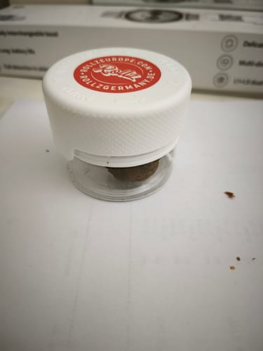 Customer's container of THC-A 45% Hash La Mousse with a red branded lid.