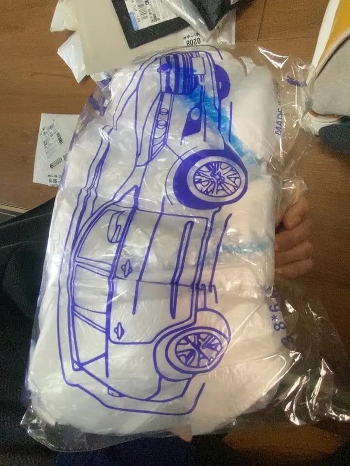 Customer photo review of All-Weather Disposable PE Car Cover – Indoor/Outdoor Dust & Rain Protection