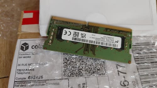 Customer's Micron DDR4 memory module resting on a shipping label after delivery.