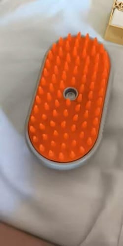 Customer photo review of 3-in-1 Steamy Pet Brush and Massage Comb – Spray Grooming Tool for Dogs and Cats