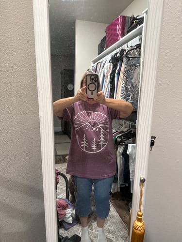 Customer's Mountain Sunset T-shirt in size L, worn in front of a mirror with jeans.