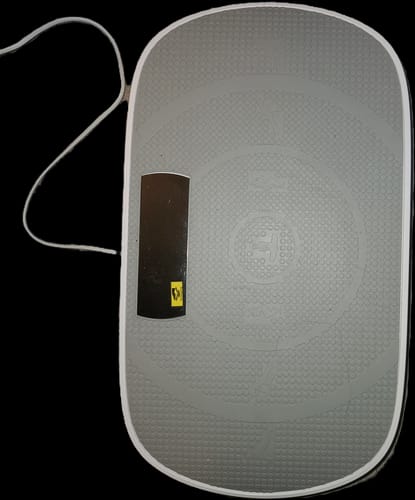 Customer's gray CV30 Pro vibration plate with a black control panel shown from above.