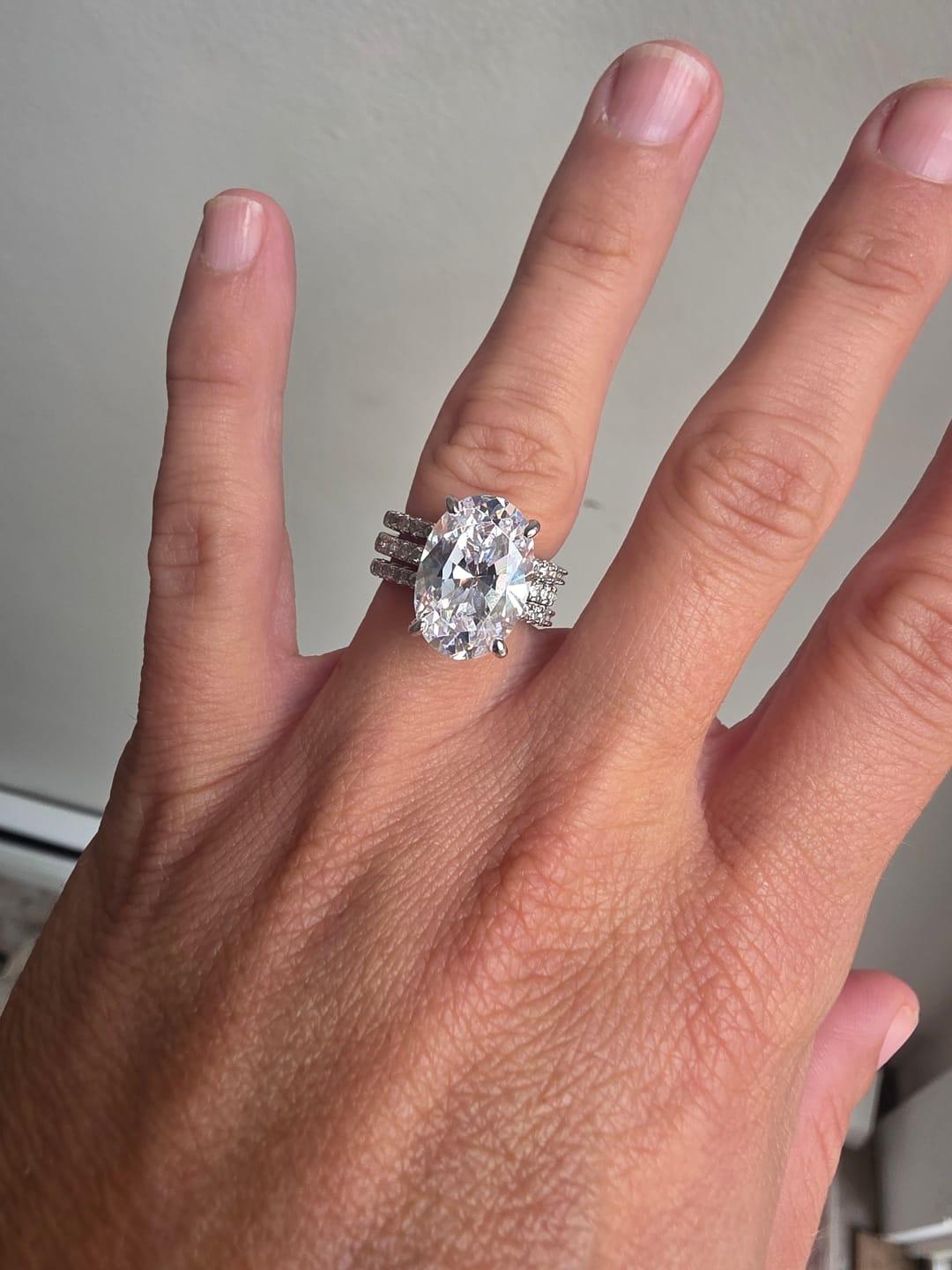 Customer photo review of Solitaire Hidden Halo 5.5ct Oval CZ Ring Set in Sterling Silver